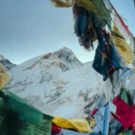 Majestic Mount Everest through Vibrant Prayer Flags