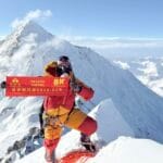 One of the Sherpa rope fixers yesterday on the summit of Lhotse, with Everest in background. Photo: 8K Expeditions