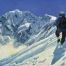 A painted illustration of a solitary mountaineer ascending a steep, snow-covered slope under a clear blue sky. The climber, seen from behind, wears heavy winter gear including a hooded jacket, pants, boots, gloves, and goggles, while carrying a large backpack and holding an ice axe planted in the snow for support. In the background looms a massive, jagged, snow-capped mountain peak partially shrouded in blowing snow or mist, evoking the dramatic and challenging nature of high-altitude alpine climbing.