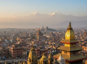 Panoramic sunset view over Kathmandu Valley with historic temples and Himalayan snow peaks in the background