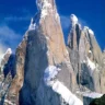 Cerro Torre mountain peak with snow, Patagonia blue sky view