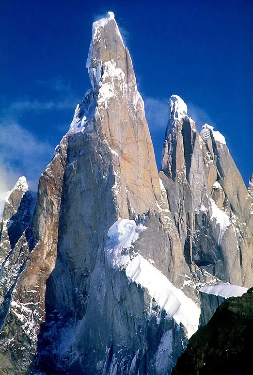 Cerro Torre mountain peak with snow, Patagonia blue sky view