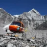 helicopter behind of mountains