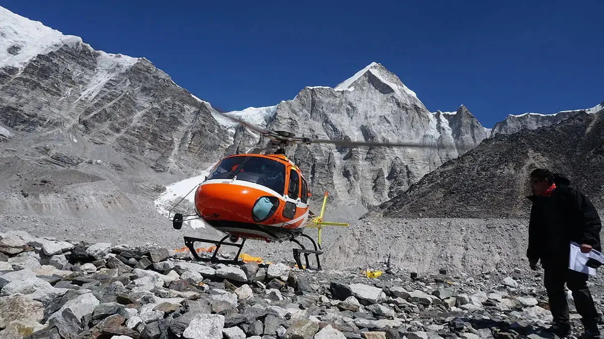 helicopter behind of mountains